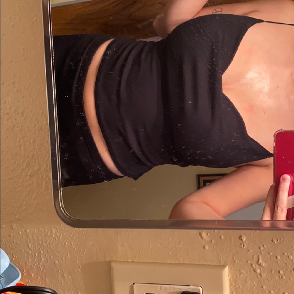 Sexy dress up top w a strapy back. Good quality